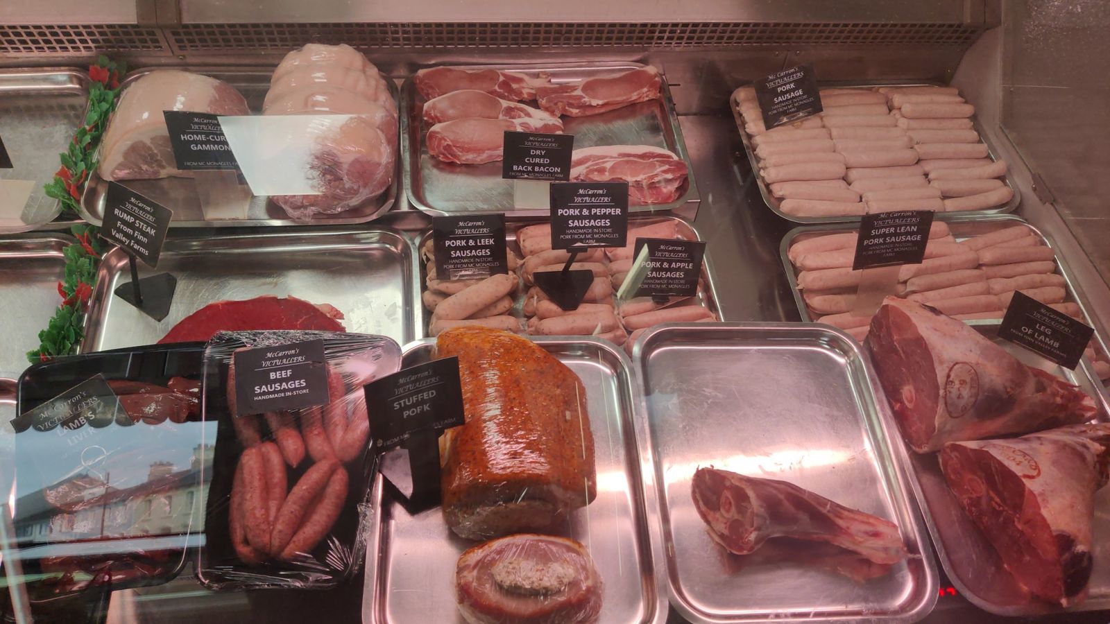 Pork counter with home-cured gammon, dry cured back bacon, handmade sausages, stuffed pork and legs of lamb