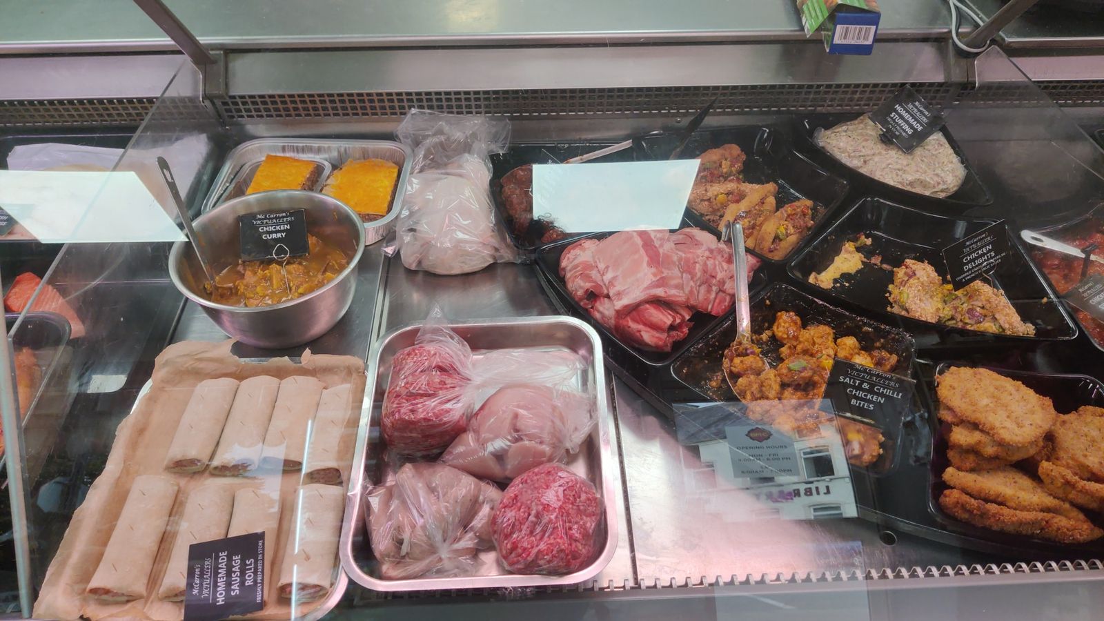 Ready-to-cook counter with chicken curry, homemade sausage rolls, homemade stuffing, salt and chilli chicken bites and mince
